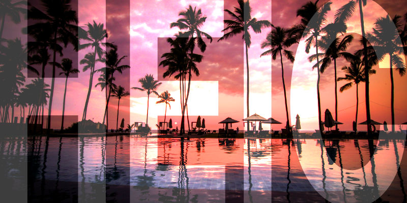 A sunset scene of a tropical resort with the words HEIC superimposed on top.