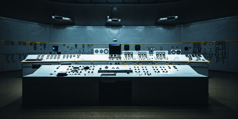 A control console at a power station lit from above.