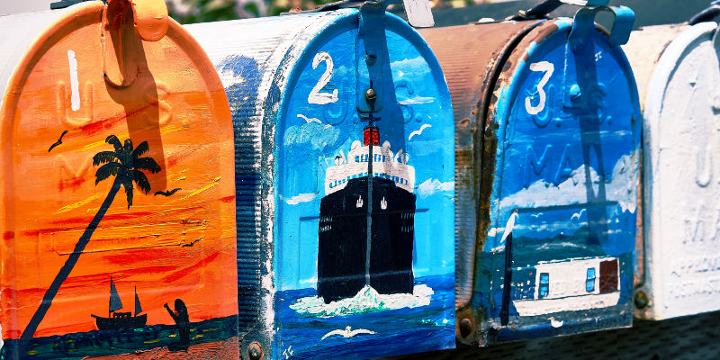 A stacked set of inboxes with red and white light streaks behind.