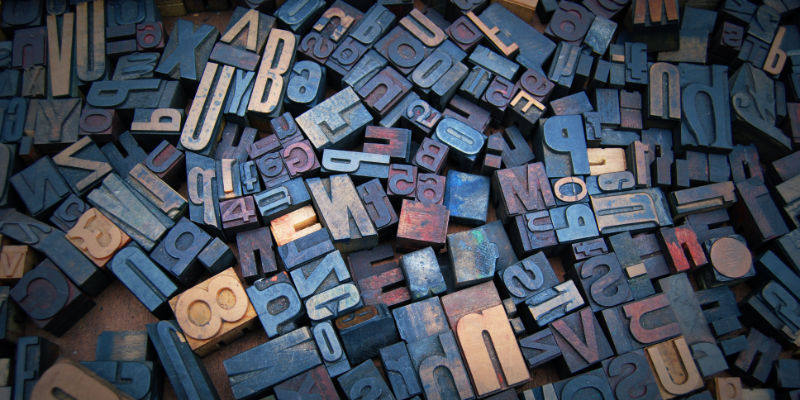 A jumble of letter stamps for use in a traditional printing press.