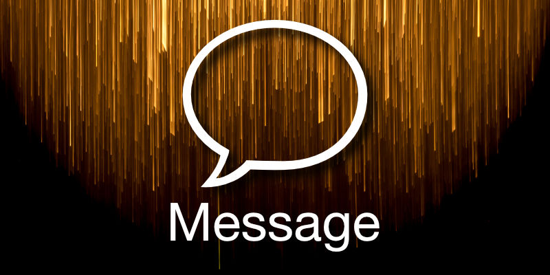 The outline of a rounded speech bubble backlight by a cascade of golden streaks from the top.